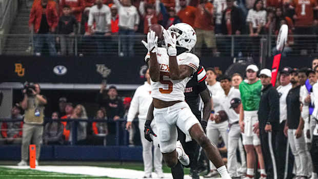 Big 12: Texas Longhorns wide receiver Adonai Mitchell (5) makes a catch for a first down against the Oklahoma State Cowboys.